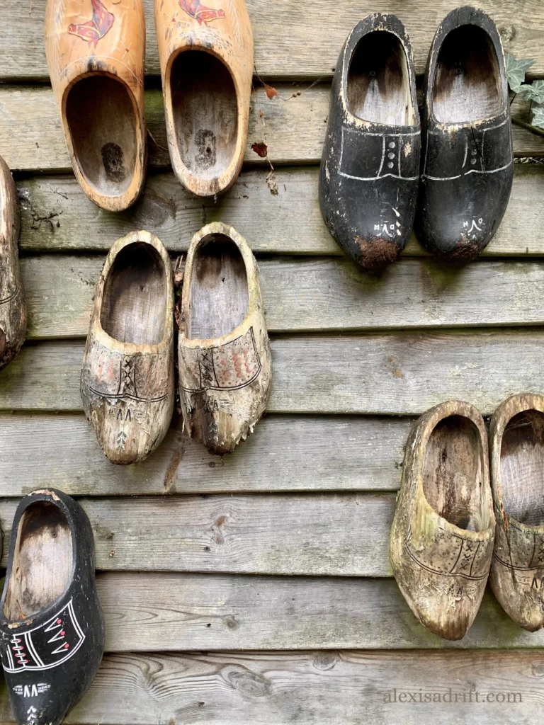 Giethoorn, Netherlands. Clogs on wall in village.