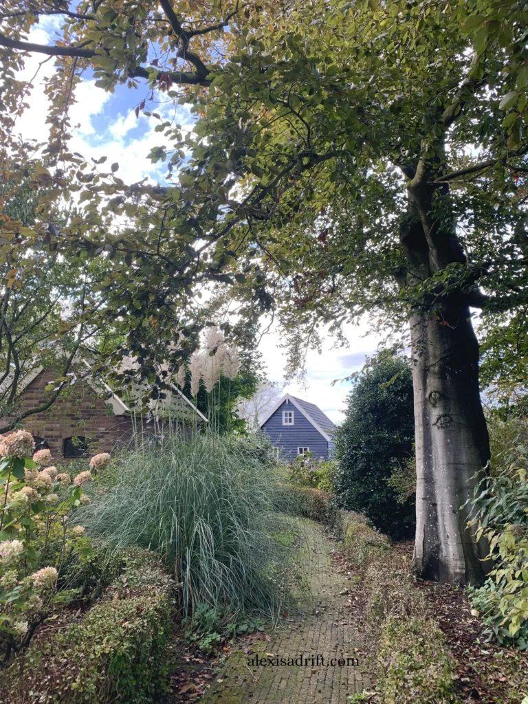 Giethoorn Netherlands. Blue cottage with walking path.